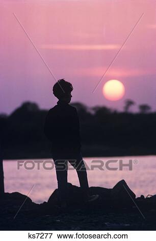 1970S Silhouetted Woman Looking Over Water At Sunset Stonington Connecticut View Large Photo Image Stock Photo - 1970S Silhouetted Woman Looking Over Water At Sunset Stonington Connecticut. Fotosearch