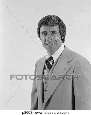 Stock Image - 1970S Smiling Portrait Business Man Three Piece Suit With Vest Looking At Camera. Fotosearch