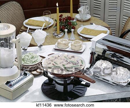 1970S Still Life Blender Frozen Daiquiri Avocado Dip Ham Casserole Meringue Tarts Table Set For Dinner For Two View Large Photo Image Stock Photograph - 1970S Still Life Blender Frozen Daiquiri Avocado Dip Ham Casserole Meringue Tarts Table Set For Dinner For Two. Fotosearch