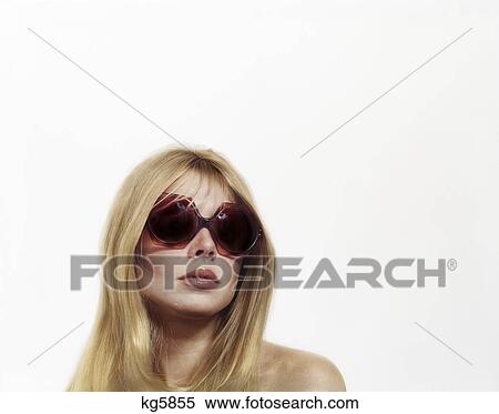 1970S Sultry Blond Woman Wearing Oversize Vintage Sunglasses View Large Photo Image Stock Photography - 1970S Sultry Blond Woman Wearing Oversize Vintage Sunglasses . Fotosearch