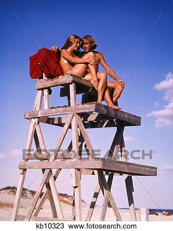 1970S Teen Couple On Life Guard Stand View Large Photo Image Stock Image - 1970S Teen Couple On Life Guard Stand. Fotosearch