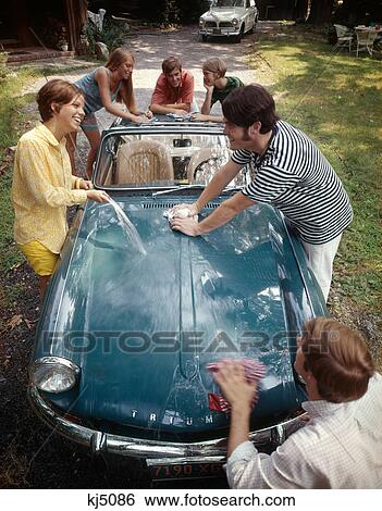 1970S Teenage Group Of 3 Boys And 3 Girls Together Washing Triumph Spitfire Sports Car View Large Photo Image Stock Photograph - 1970S Teenage Group Of 3 Boys And 3 Girls Together Washing Triumph Spitfire Sports Car. Fotosearch