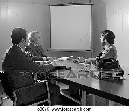 1970S Three Executive Businessmen Conference Table Audiovisual Presentation View Large Photo Image Stock Photograph - 1970S Three Executive Businessmen Conference Table Audiovisual Presentation. Fotosearch