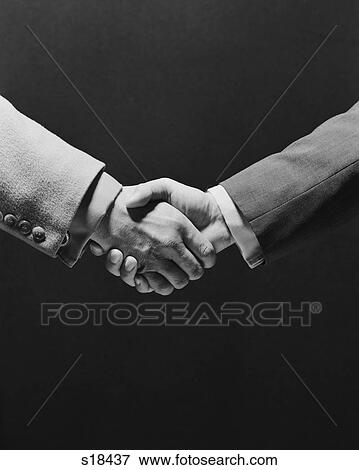 Stock Photo - 1970S Two Businessmen Shaking Hands. Fotosearch