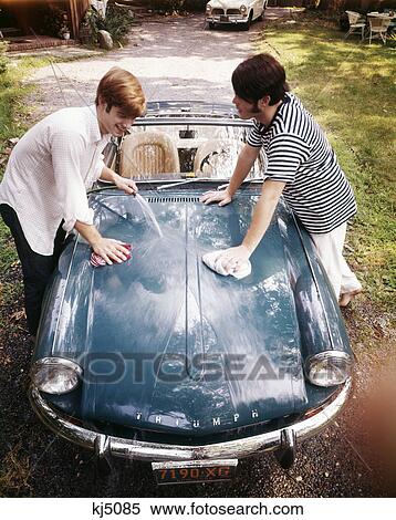 1970S Two Teenaged Boys Washing Triumph Sports Car Convertible View Large Photo Image Stock Photography - 1970S Two Teenaged Boys Washing Triumph Sports Car Convertible . Fotosearch