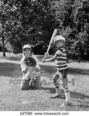 1980S Boy At Bat With Mother Kneeling Behind Him As Catcher View Large Photo Image Stock Image - 1980S Boy At Bat With Mother Kneeling Behind Him As Catcher. Fotosearch