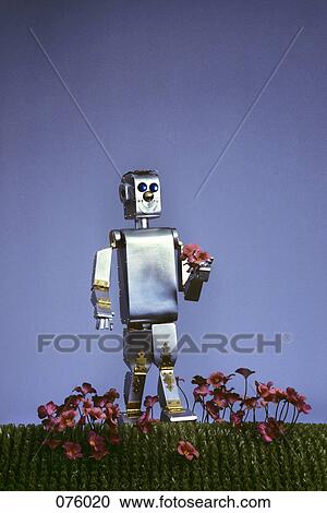1980S Futuristic Silver Robot Toy Walking In Flowers View Large Photo Image Stock Image - 1980S Futuristic Silver Robot Toy Walking In Flowers. Fotosearch