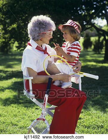 1980S Grandmother And Girl In Red White Tennis Outfits View Large Photo Image Stock Image - 1980S Grandmother And Girl In Red White Tennis Outfits. Fotosearch