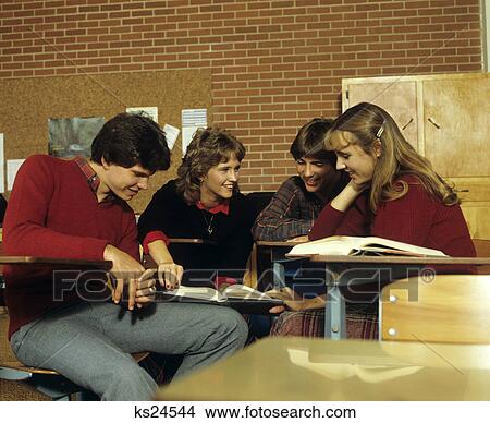 1980S Group Of Teen Studying Smiling Reading Textbook View Large Photo Image Picture - 1980S Group Of Teen Studying Smiling Reading Textbook. Fotosearch