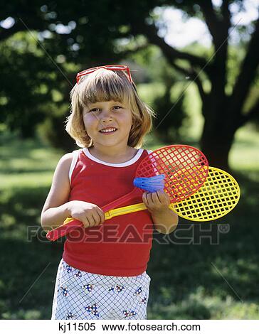 Stock Photography - 1980S Little Girl Holding Badminton Ball And And Racquets . Fotosearch