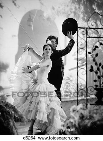 1980S Man And Woman Flamenco Dancers In Outside Setting The Man Is Holding His Hat Above His Head With His Right Hand View Large Photo Image Picture - 1980S Man And Woman Flamenco Dancers In Outside Setting The Man Is Holding His Hat Above His Head With His Right Hand. Fotosearch
