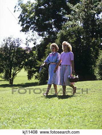 1980S Mother And Teen Daughter Walking In Park Yard View Large Photo Image Stock Photo - 1980S Mother And Teen Daughter Walking In Park Yard. Fotosearch