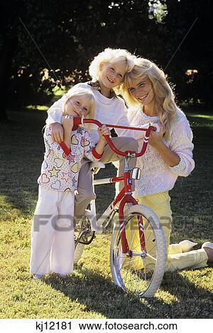 1980S Mother And Two Daughters Outdoors With Bicycle View Large Photo Image Stock Image - 1980S Mother And Two Daughters Outdoors With Bicycle . Fotosearch