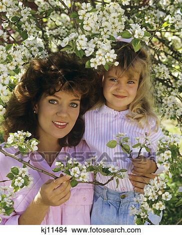 1980S Mother & Daughter Portrait With Apple Blossoms View Large Photo Image Picture - 1980S Mother & Daughter Portrait With Apple Blossoms. Fotosearch
