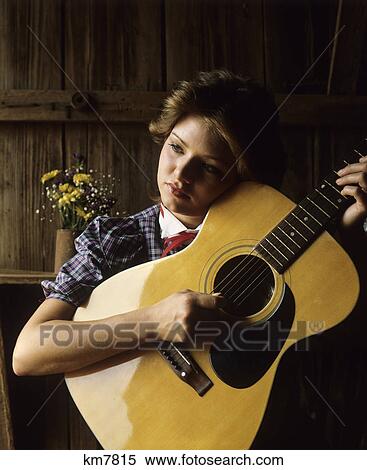 1980S Sad Pensive Woman Playing Guitar View Large Photo Image Stock Photography - 1980S Sad Pensive Woman Playing Guitar. Fotosearch