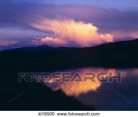 1980S Sunset Clouds Reflected In Mountain Lake Water View Large Photo Image Stock Image - 1980S Sunset Clouds Reflected In Mountain Lake Water . Fotosearch