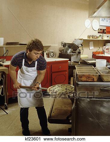 1980S Teen Boy Putting Pizza In Commercial Oven View Large Photo Image Stock Image - 1980S Teen Boy Putting Pizza In Commercial Oven. Fotosearch