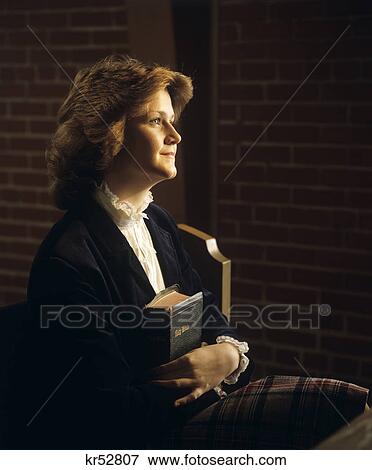 1980S Teen Girl Sitting Church Pew Holding Bible View Large Photo Image Stock Photo - 1980S Teen Girl Sitting Church Pew Holding Bible. Fotosearch