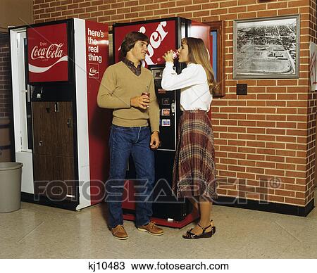 1980S Teenage Boy Girl Standing At Soda Vending Machines View Large Photo Image Stock Image - 1980S Teenage Boy Girl Standing At Soda Vending Machines. Fotosearch