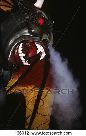 Stock Image - 1990S Amusement Park Ride Devil With Smoke Coming Out Of Nose . Fotosearch