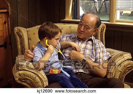 1990S Grandson Examining Grandfather With Toy Stethoscope View Large Photo Image Stock Image - 1990S Grandson Examining Grandfather With Toy Stethoscope. Fotosearch