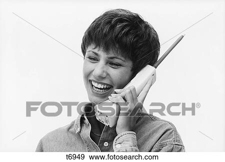 1990S Smiling Woman Talking On Cordless Telephone View Large Photo Image Stock Photo - 1990S Smiling Woman Talking On Cordless Telephone. Fotosearch