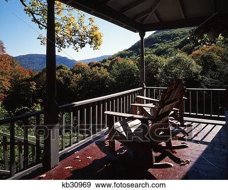 Stock Photo - 1990S Two Adirondack Rocking Chairs On Porch Overlooking The Hudson River Highlands. Fotosearch