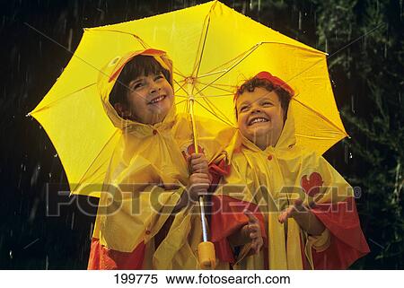 1990S Two Girls With Umbrella And Yellow Rain Slickers View Large Photo Image Stock Photography - 1990S Two Girls With Umbrella And Yellow Rain Slickers . Fotosearch