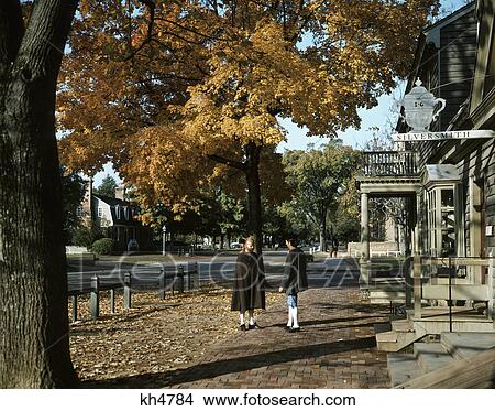 Picture - 1990S Two Men In Colonial Clothes By Silversmith Shop On Duke Of Gloucester Street Williamsburg Virginia Usa. Fotosearch