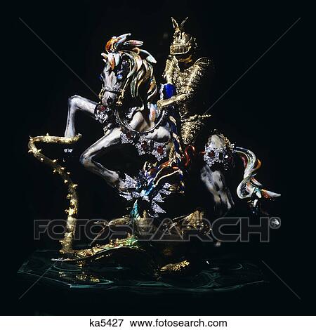 Stock Photo - 2000S Enameled Jewel Encrusted Figurine Of Saint George Slaying The Dragon. Fotosearch