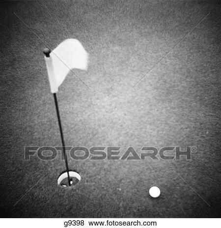 2000S Golf Ball On Putting Green With Flag Marker In Hole From Above View Large Photo Image Stock Photo - 2000S Golf Ball On Putting Green With Flag Marker In Hole From Above . Fotosearch