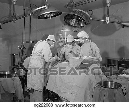 Doctors In Operating Room Operating On Patient View Large Photo Image Stock Photo - Doctors In Operating Room Operating On Patient. Fotosearch
