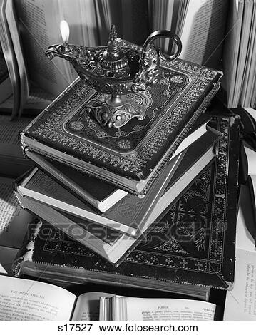 Lamp Of Knowledge With Flame On Stack Of Classic Leather Books View Large Photo Image Stock Photo - Lamp Of Knowledge With Flame On Stack Of Classic Leather Books. Fotosearch