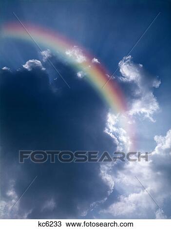 Rainbow In Sky With Sun Rays Coming From Cloud View Large Photo Image Stock Image - Rainbow In Sky With Sun Rays Coming From Cloud. Fotosearch