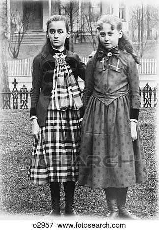 1880S 1900S 1890S Turn Of The Century Portrait Two Girls Posing Standing Arm In Arm On Lawn Backyard View Large Photo Image Stock Photo - 1880S 1900S 1890S Turn Of The Century Portrait Two Girls Posing Standing Arm In Arm On Lawn Backyard. Fotosearch