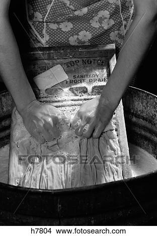1920S 1930S 1940S Close-Up Of Woman'S Hands Scrubbing Clothes On Washboard View Large Photo Image Picture - 1920S 1930S 1940S Close-Up Of Woman'S Hands Scrubbing Clothes On Washboard. Fotosearch