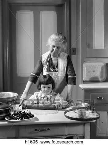 1920S 1930S Grandmother Baking Cherry Pie Teaching Granddaughter To Use Rolling Pin View Large Photo Image Stock Photography - 1920S 1930S Grandmother Baking Cherry Pie Teaching Granddaughter To Use Rolling Pin. Fotosearch