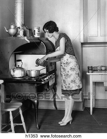 1920S Housewife At Stove Cooking View Large Photo Image Stock Image - 1920S Housewife At Stove Cooking. Fotosearch