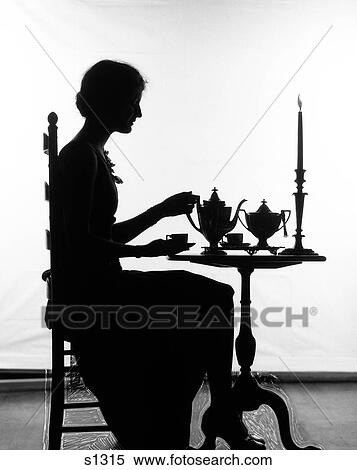1920S Silhouette Of Woman Sitting At Table Pouring Cup Of Tea View Large Photo Image Stock Photography - 1920S Silhouette Of Woman Sitting At Table Pouring Cup Of Tea. Fotosearch