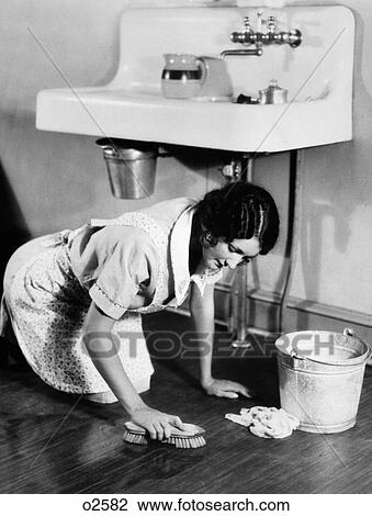 1920s Woman On Hands Knees With Bucket Brush Scrubbing