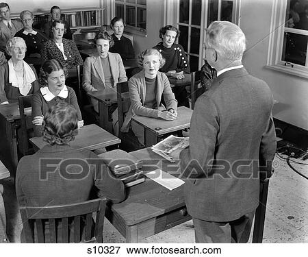 1930S 1940S Group Men And Women Vocational Training Lecture Classroom Job Training Class With Older Teacher Adult Education View Large Photo Image Stock Photo - 1930S 1940S Group Men And Women Vocational Training Lecture Classroom Job Training Class With Older Teacher Adult Education. Fotosearch