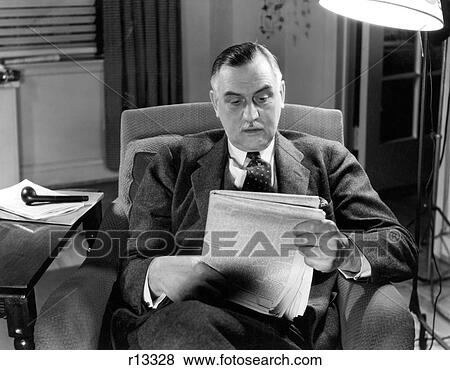 1930S 1940S Older Businessman Sitting In Chair Reading Newspaper View Large Photo Image Stock Photo - 1930S 1940S Older Businessman Sitting In Chair Reading Newspaper. Fotosearch