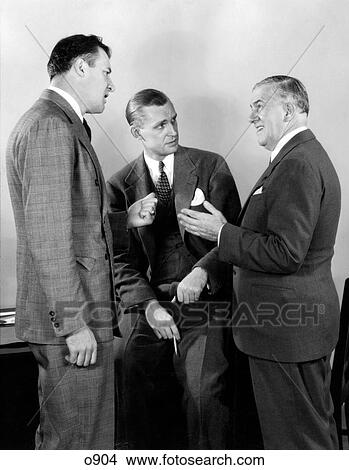 1930S 1940S Three Businessmen Salesmen Having A Discussion In Office View Large Photo Image Picture - 1930S 1940S Three Businessmen Salesmen Having A Discussion In Office. Fotosearch