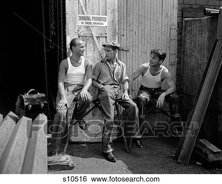 1930S 1940S Three Workmen Sitting Under No Smoking Sign Smoking Cigarette And Pipe Job Safety View Large Photo Image Stock Photograph - 1930S 1940S Three Workmen Sitting Under No Smoking Sign Smoking Cigarette And Pipe Job Safety. Fotosearch