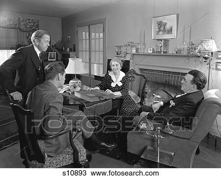 1930S 1940S Two Salesmen Making Sales Presentation To Older Couple Husband And Wife Sitting In Living Room View Large Photo Image Stock Image - 1930S 1940S Two Salesmen Making Sales Presentation To Older Couple Husband And Wife Sitting In Living Room. Fotosearch