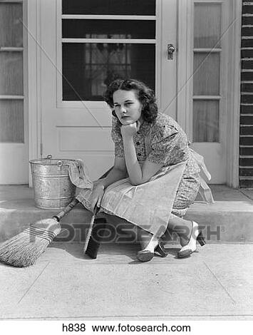 1930S 1940S Woman Housewife Sitting On Front Door Step Surrounded By Household Cleaning Tools Thinking Or Worrying View Large Photo Image Stock Photo - 1930S 1940S Woman Housewife Sitting On Front Door Step Surrounded By Household Cleaning Tools Thinking Or Worrying . Fotosearch