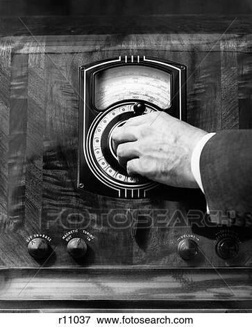 Stock Photo - 1930S Close Up Man'S Hand Turning Radio Dial. Fotosearch