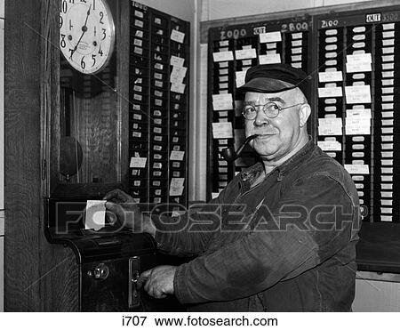 1930S Elderly Factory Worker In Overalls Smoking Pipe Punching Time Card View Large Photo Image Stock Photo - 1930S Elderly Factory Worker In Overalls Smoking Pipe Punching Time Card. Fotosearch