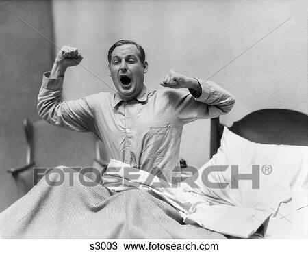 1930S Man In Bed Waking Up Yawning And Stretching View Large Photo Image Stock Image - 1930S Man In Bed Waking Up Yawning And Stretching. Fotosearch