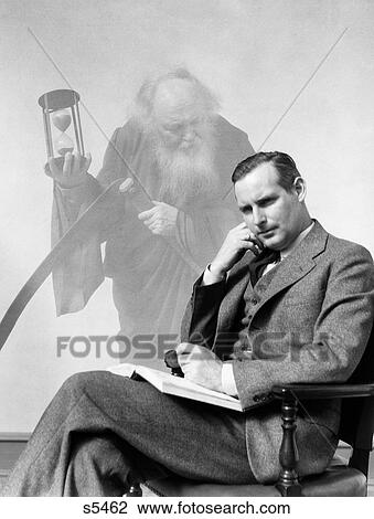 1930S Man In Suit Seated With Book In Lap & Pipe In Hand With Pensive Look With Grim Reaper Ghosted In Background View Large Photo Image Stock Image - 1930S Man In Suit Seated With Book In Lap & Pipe In Hand With Pensive Look With Grim Reaper Ghosted In Background. Fotosearch